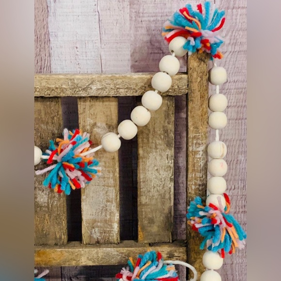 6 Foot Wood Bead Garland with Multi-Colored Yarn Pom Poms - Picture 3 of 9